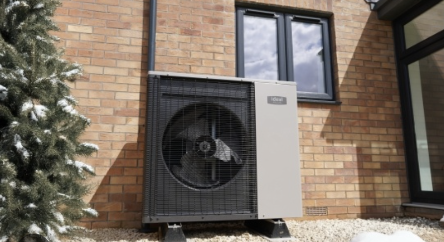 Air source heat pump outdoor unit outside a home for Boiler Upgrade Scheme guide