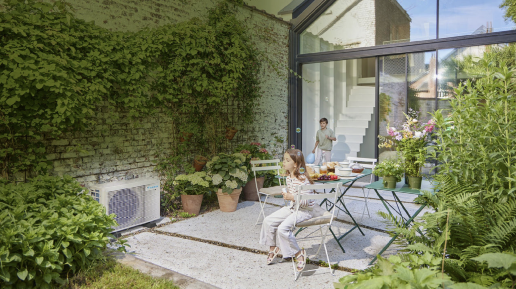 Little girl in a garden with a air source heat pump, blowing bubbles